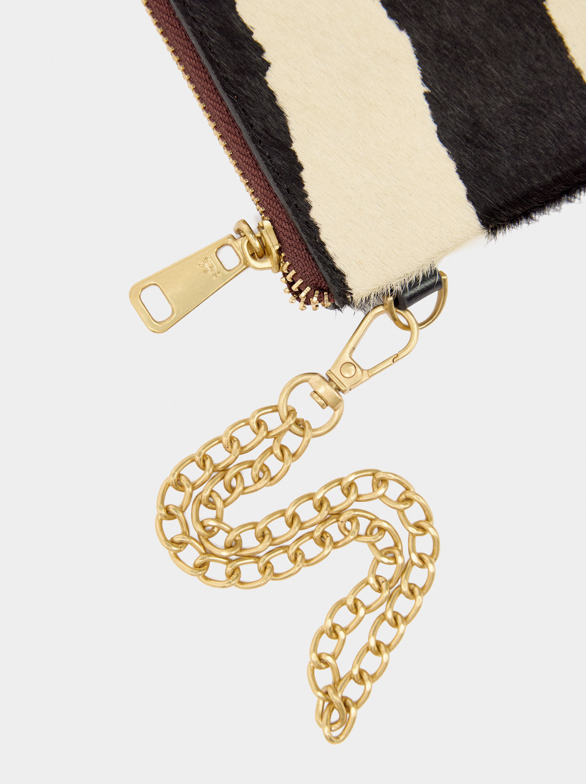 Bolso multifuncional de piel con pelo y estampado animal